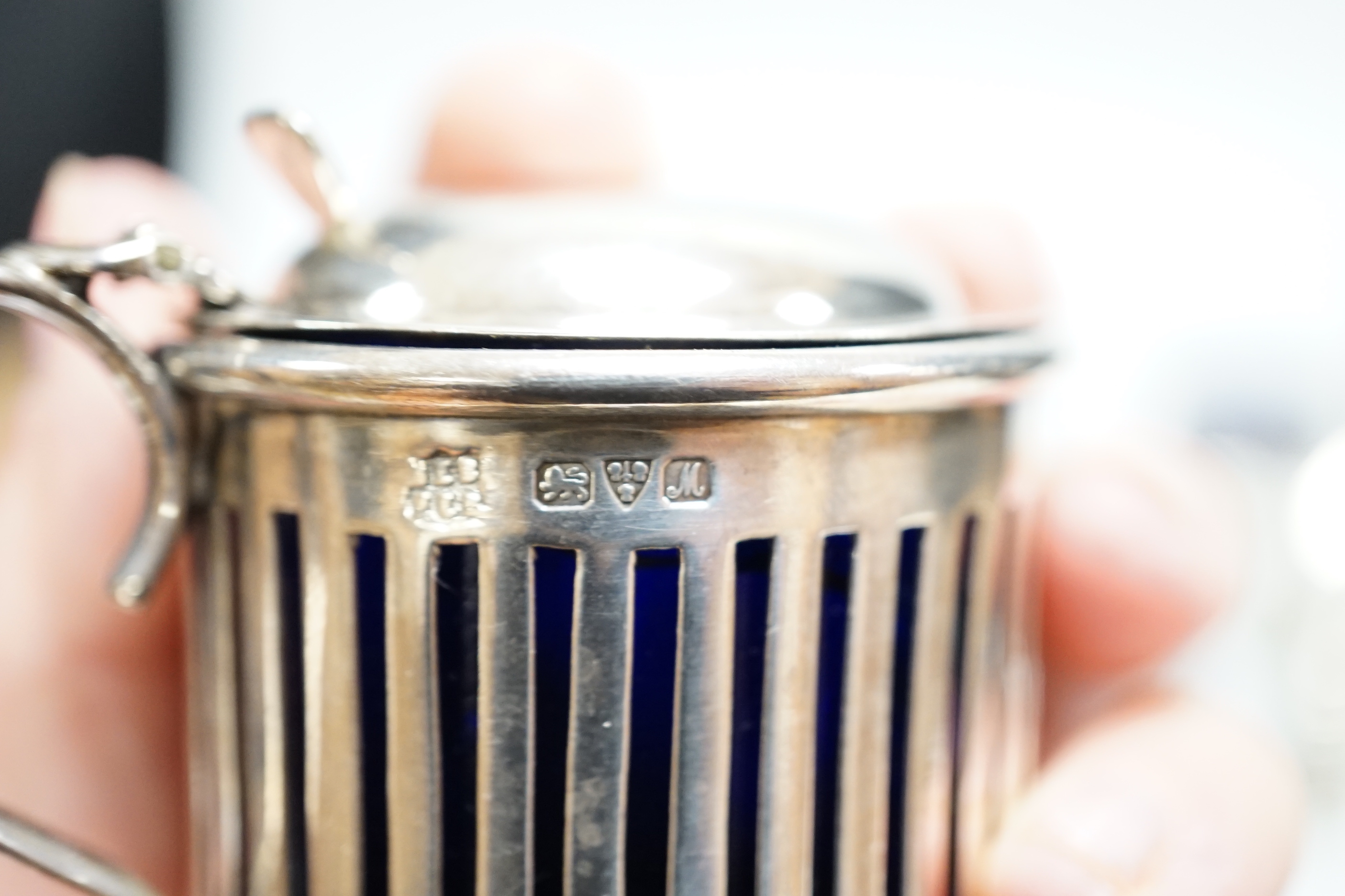 Eight assorted silver condiments, including a George III oval salt and four other items including small inkwell.